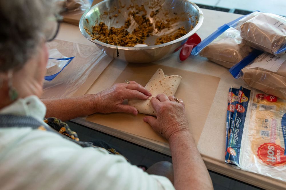 Plating and prepping food together at the counter