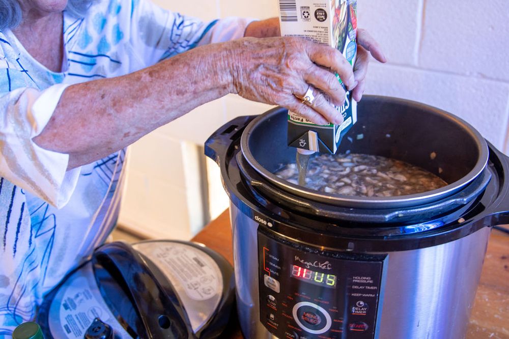 Scooping a hot batch straight into meal bags