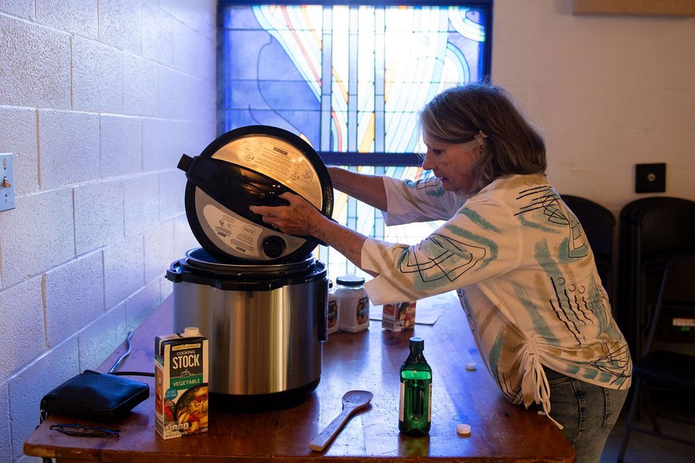 Serving warm food from slow cookers at a community gathering