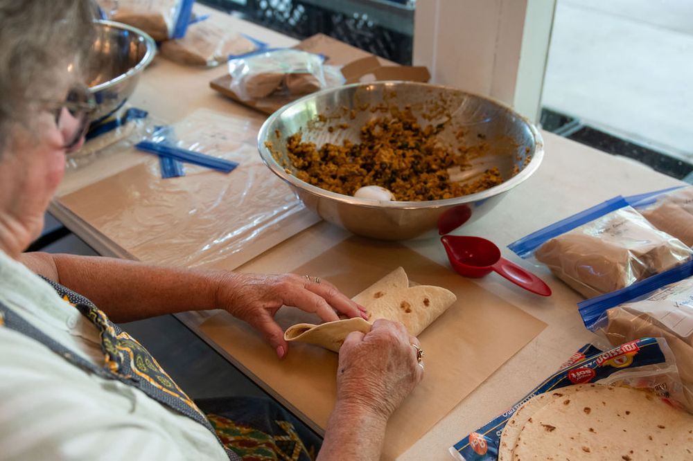 Trays of food and bags of meals mid cook day